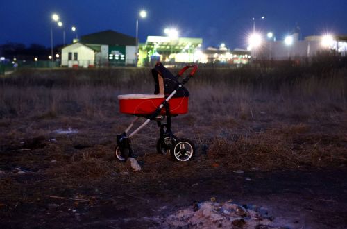 A pram left behind at a border crossing at Poland. Pic: Reuters/Kai Pfaffenbach