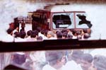 Bus damaged in mob violence in Bombay