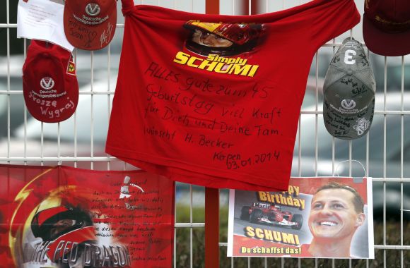 Caps, flags and a shirt marking the 45th birthday of seven-times former Formula One world champion Michael Schumacher 