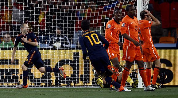 Spain's Andres Iniesta (L) celebrates scoring.