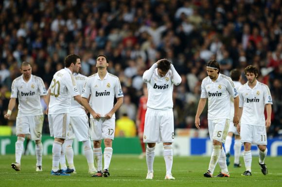 Real Madrid players dejected after losing their sem-final game to Bayern Munich in 2012