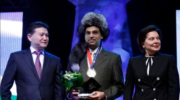 FIDE President Kirsan Ilyumzhinov, left, with Candidates 2014 winner Viswanathan Anand and the governor of Russia's Khanty-Mansiysk Autonomous Region Yugra Natalia Komarova.