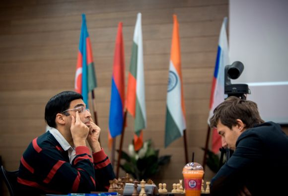 Viswanathan Anand takes a break as his opponent ponders his move.