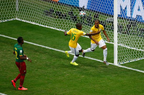 Fernandinho of Brazil (R) celebrates scoring his team's fourth goal with Ramires 