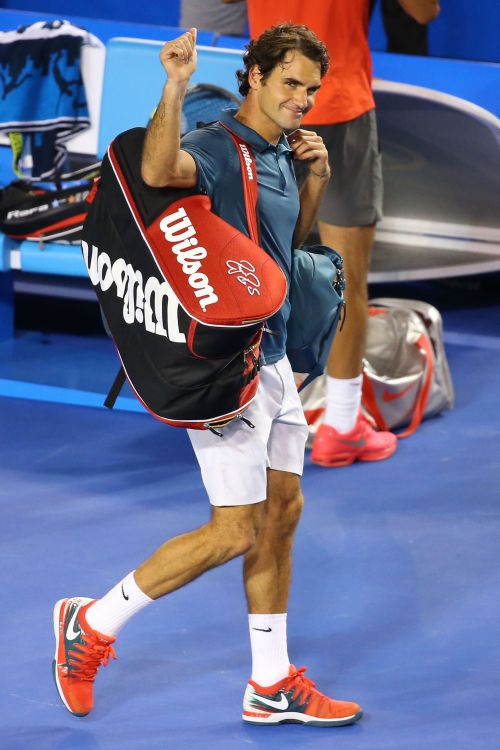 Roger Federer walks back after losing to Rafa Nadal