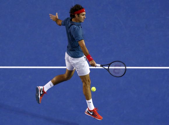 Roger Federer plays a return shot