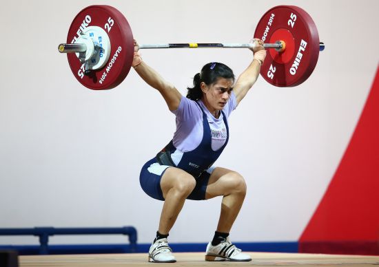 Santoshi Matsa of India lifts in the Women's 53kg Group A Weightlifting at the Scottish Exhibition And Conference Centre 