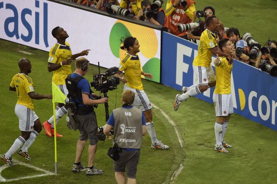 James Rodriguez of Colombia celebrates scoring his team's first goal 