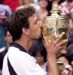 Goran Ivanisevic kisses his trophy