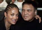 Muhammad Ali (R) poses with his daughter Laila Ali 