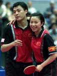 Yang Yin (R) and Qin Zhijian celebrate after winning the mixed doubles final