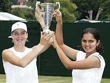 Sania and Russian Alisa Kleybanova with the Wimbledon trophy