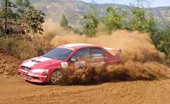 Armin Kremer of Team MRF Tyres negotiates his Mitsubishi Lancer Evo 7 through the second Special Stage at Lake City, Panshet, near Pune.