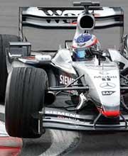 Kimi Raikkonen drives his McLaren Mercedes MP4-17D during practice