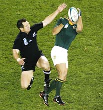 Too easy: All Blacks fullback Leon MacDonald in action during the quarter-final against South Africa