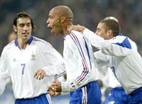 Robert Pires (L), Thierry Henry (C) and David Trezeguet (R) of France celebrate the second goal against Germany