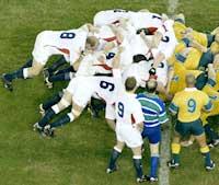 The England and Australian teams contest a scrum