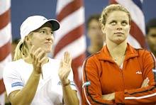 Justine Henin-Hardenne (L) stands with compatriot Kim Clijsters after the women's final