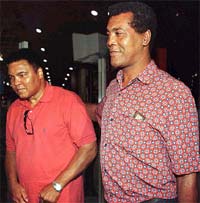 Former heavy-weight boxing champion Mohamed Ali (L) walking alongside former Cuban heavy-weight amateur champion Teofilo Stevensen