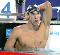 Michael Phelps of the U.S looks at the scoreboard after the men's 200 metres freestyle final