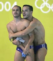 Greece's Nikolaos Siranidis (L) and Thomas Bimis await the results of the men's synchronised 3 metre springboard final