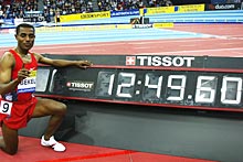 Kenenisa Bekele celebrates breaking the 5,000 metres indoor world record