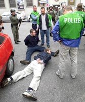 A September 1, 2001 file photo shows German riot police arresting English soccer fans after fights in Munich