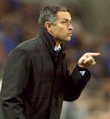 Porto FC's coach Jose Mourinho (R) talks with player Carlos Alberto