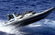 Greek elite troops on board an inflatable boat take part in exercise at Saronic gulf