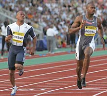 Jamaica's Asafa Powell (right) wins the men's 100m ahead of second placed Maurice Greene