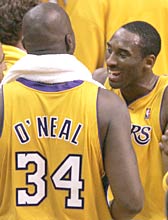 Los Angeles Lakers' Kobe Bryant (right) and Shaquille O'Neal celebrate the win over Minnesota Timberwolves in Game 6