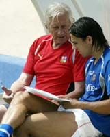 Milan Baros discusses stregies with his coach
