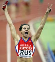 Natalya Nazarova of Russia crosses the finish line to win the women's 4x400 metres relay event of the World Indoor Athletics Championships in Budapest