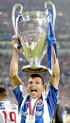 Porto's Deco holds the cup to celebrate his team's 3-0 Champions League final victory