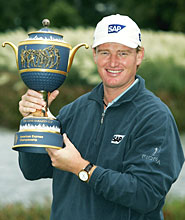 Ernie Els poses with the trophy after winning the WGC-American Express Championship