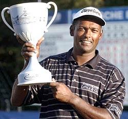 Vijay Singh poses with the Deutsche Bank Championship trophy