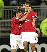 Ruud van Nistelrooy (right) is congratulated by team mate Gabriel Heinze after scoring the second goal