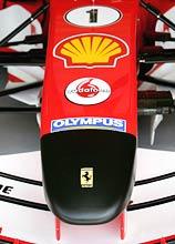 The Ferrari of Michael Schumacher supports a black nose cone as a mark of respect for the death of the Pope John Paul