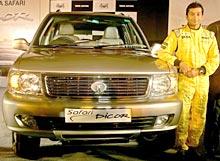 Narain Karthikeyan poses in front of the newly launched Tata Safari Dicor car in New Delhi on August 3, 2005.