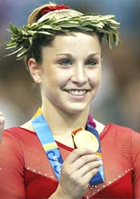 Carly Patterson shows her gold medal at the Athens 2004