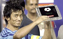 Indian football captain Bhaichung Bhutia holds the Best Player Award at the presentation ceremony of the South Asian Football Federation (SAFF) Cup on Dec 17, 2005.