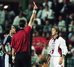 David Beckham is sent off by referee Kim Nielsen after lashing out at Diego Simeone of Argentina during the 1998 World Cup second round match