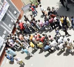 Students queue up for admission outside a college in Delhi