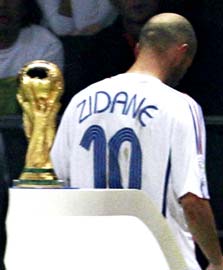 Zinedine Zidane walks past the World Cup after being sent off