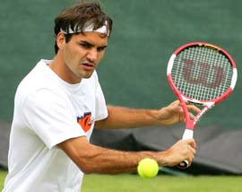 Roger Federer practises at Wimbledon