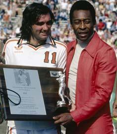 George Best presents Pele with a plaque commemorating the Brazilian as the best soccer player in the world in April 1978.