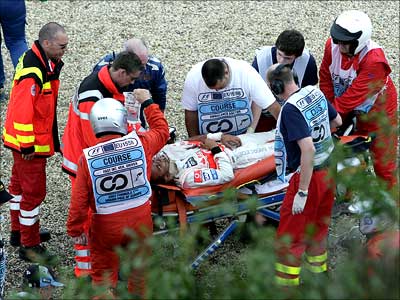 Lewis Hamilton is stretchered away by paramedics