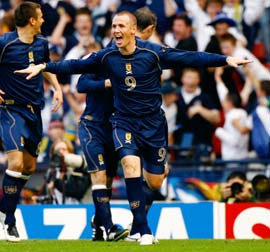 Kenny Miller celebrates after scoring a goal for Scotland