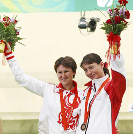 Russian rival Natalia Paderina (left) and Georgia's Nino Salukvadze 