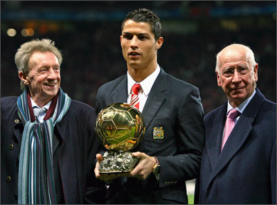 Cristiano Ronaldo (centre) with the Ballon d'or, flanked by previous winners Denis Law (left) and Bobby Charlton